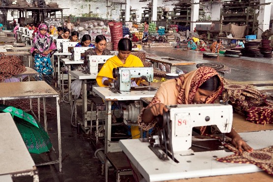 Women sewing in a manufacturing center. Image by Maruf Rahman from Pixabay