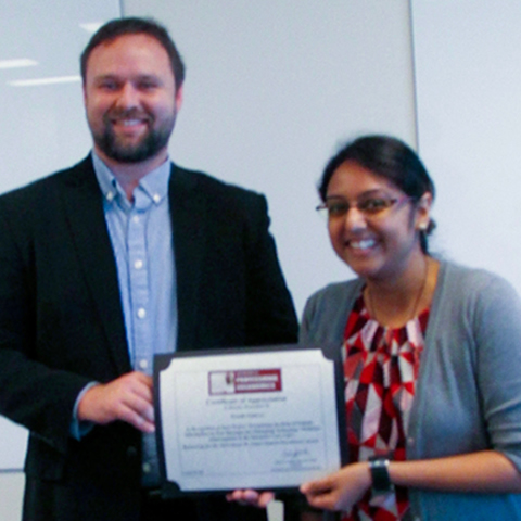 Preethi Srinivas receives her Certificate of Appreciation from her advisor, Dr. Richard J. Holden.